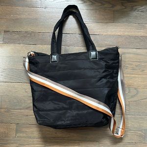 Black quilted tote bag.